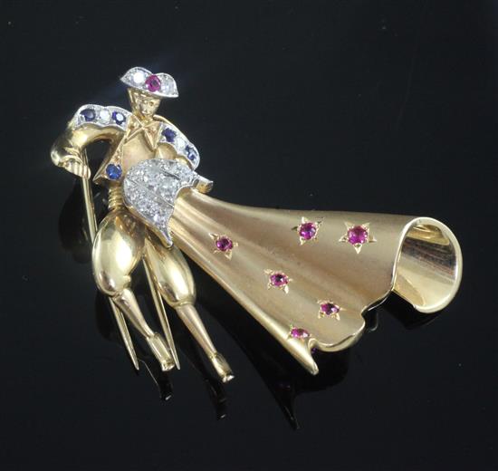 A gold, ruby, sapphire and diamond set novelty clip brooch, modelled as a Matador, 56mm.